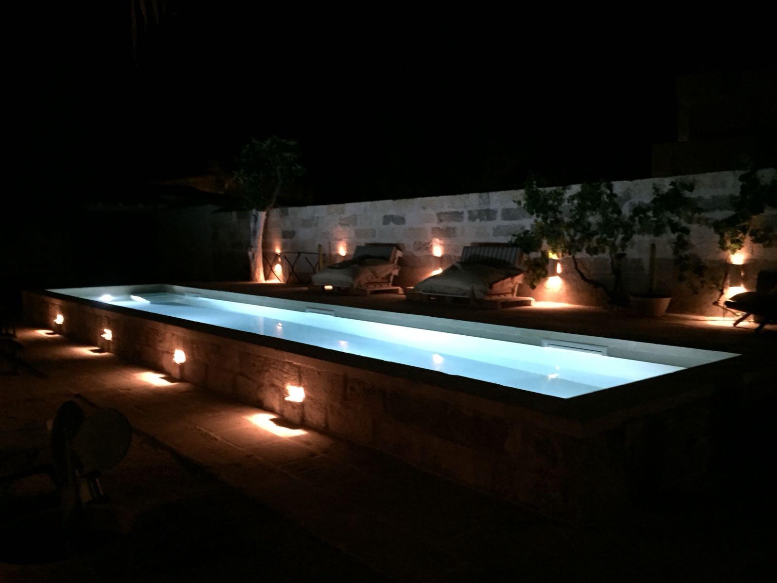 Swimming pool courtyard by night